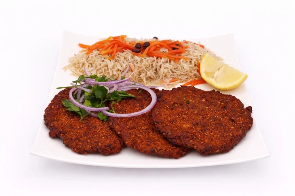 Authentic Afghan Chapli Kebob — Spiced beef patty kebob (spicy), served with bread, white an...